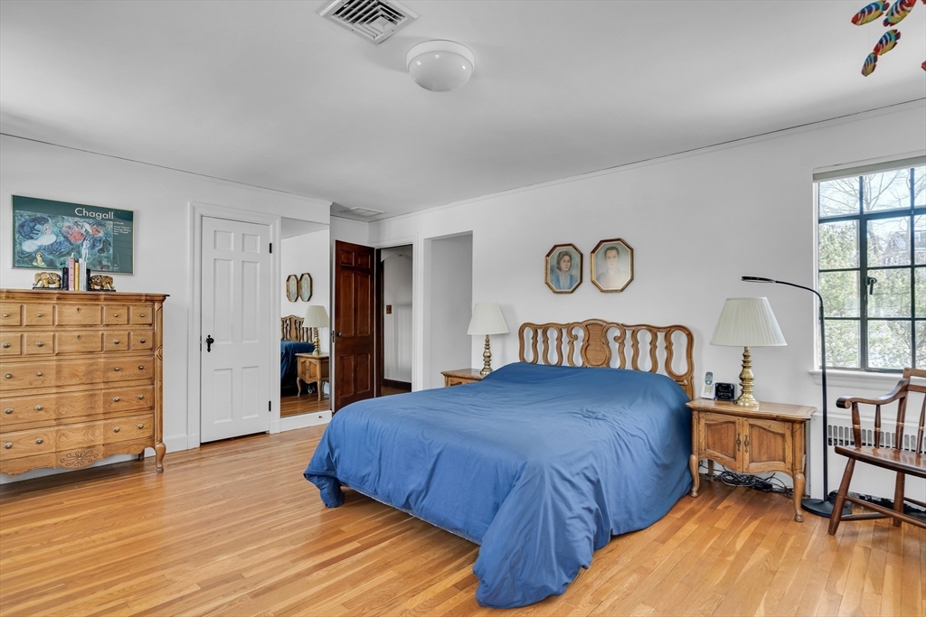 48 Avondale Road Newton, MA 02459 - Photo 29 of 37 a bedroom with a bed and a dresser