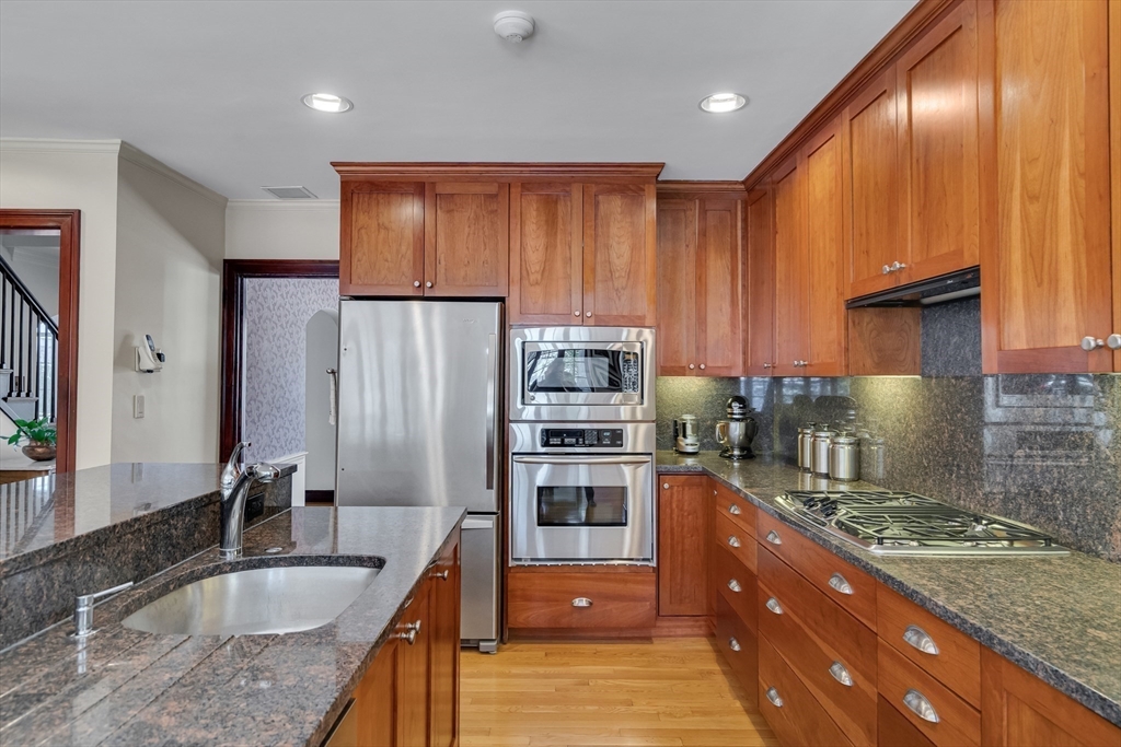 48 Avondale Road Newton, MA 02459 - Photo 4 of 37 a kitchen with stainless steel appliances granite countertop a sink stove and refrigerator