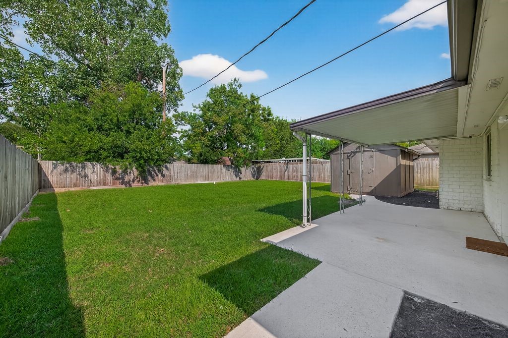 511 Bellmar Lane Friendswood, TX 77546 - Photo 22 of 29 a view of a house with a yard