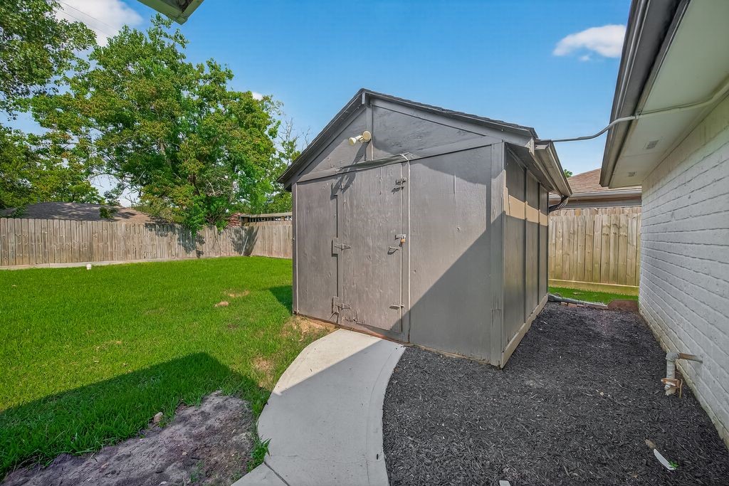 511 Bellmar Lane Friendswood, TX 77546 - Photo 27 of 29 a view of a house with a yard