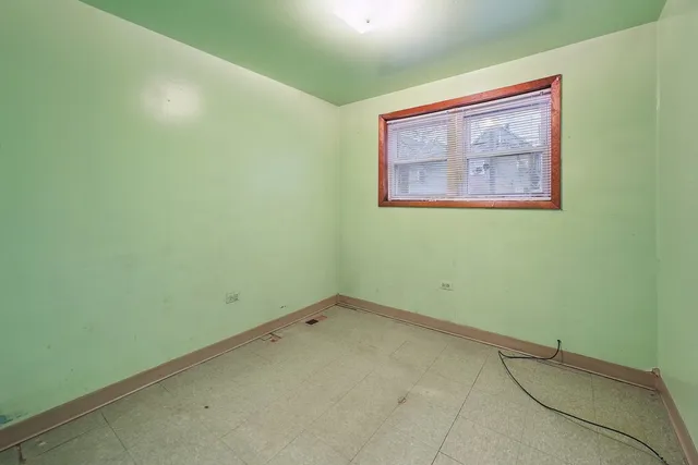 a view of empty room with wooden walls