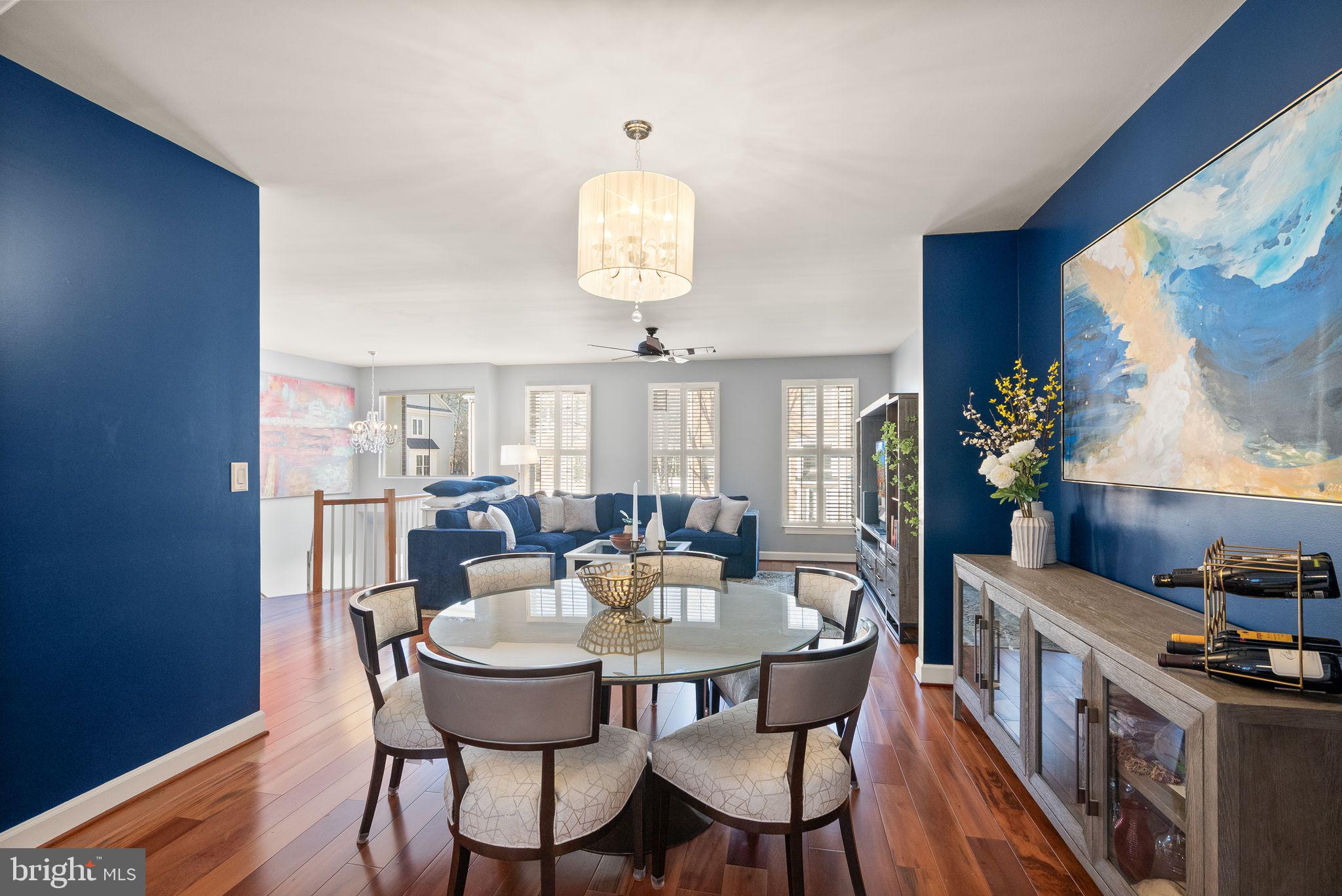 11477 Waterhaven Court Reston, VA 20190 - Photo 13 of 54 a view of a dining room with furniture and wooden floor