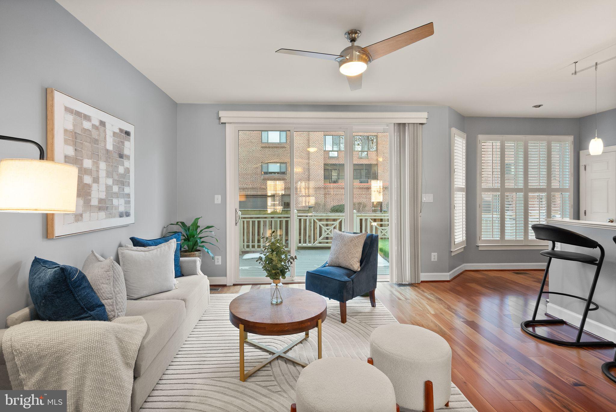 11477 Waterhaven Court Reston, VA 20190 - Photo 15 of 54 a living room with furniture and a large window