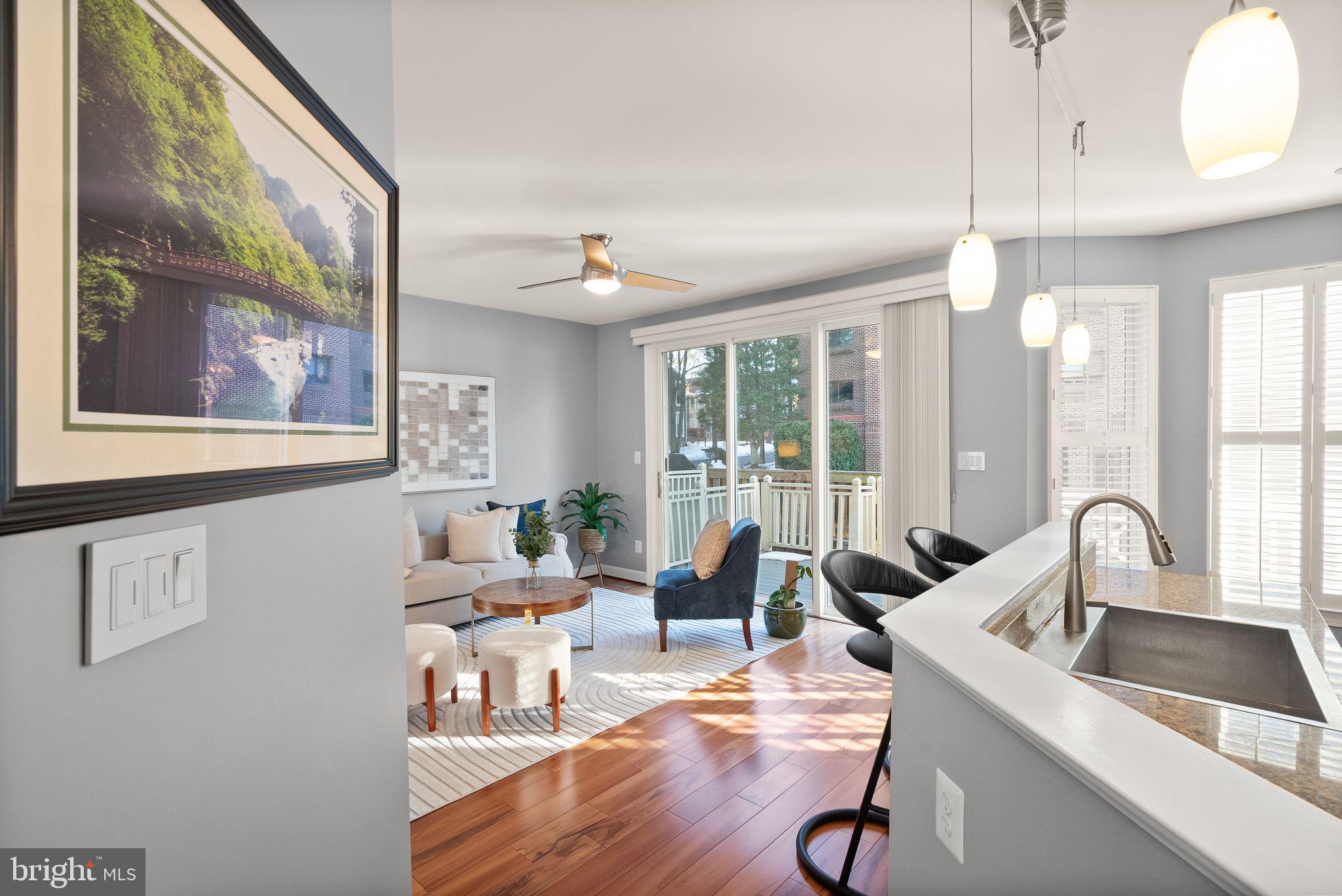 11477 Waterhaven Court Reston, VA 20190 - Photo 21 of 54 a kitchen with a sink cabinets and wooden floor