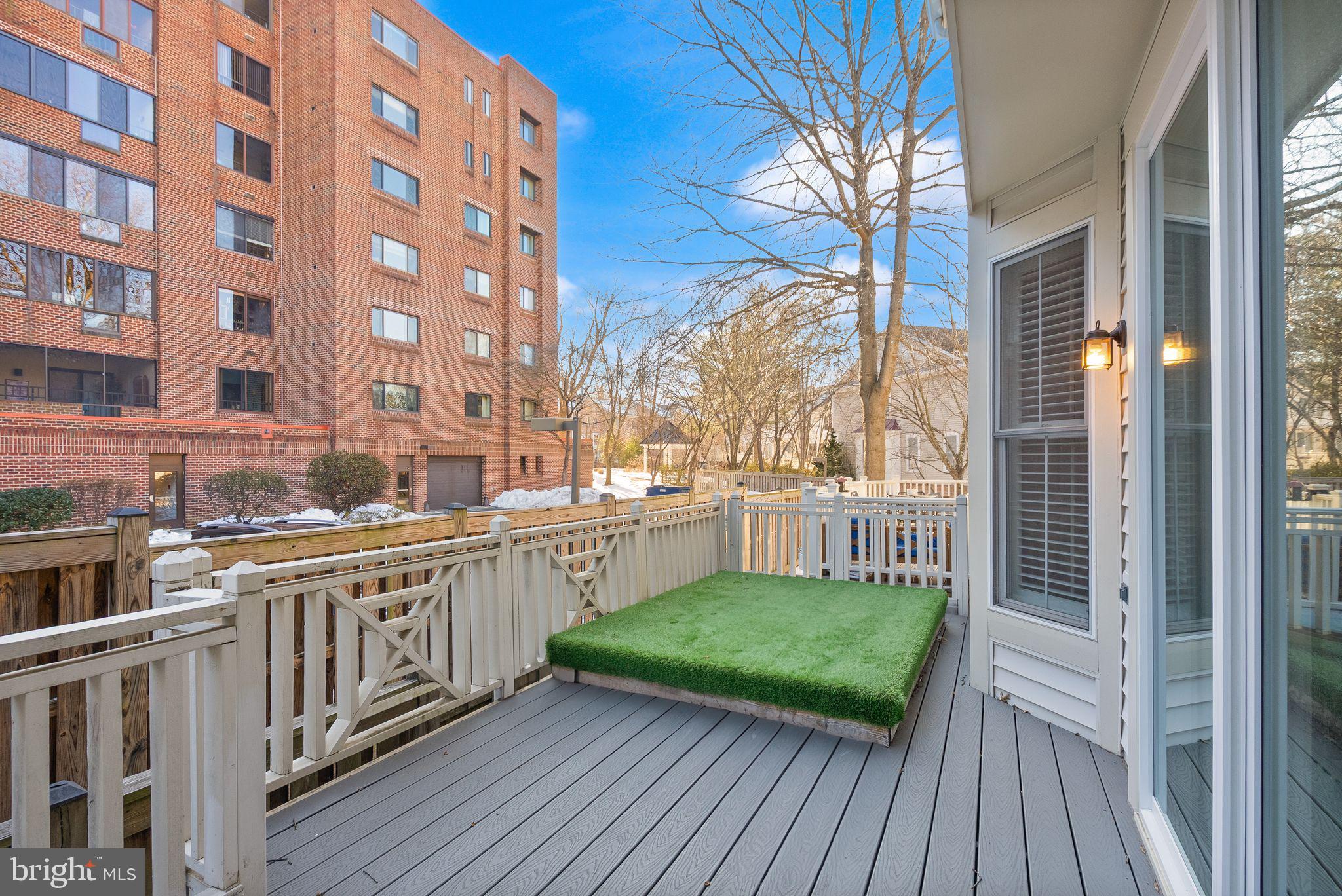 11477 Waterhaven Court Reston, VA 20190 - Photo 26 of 54 a view of a balcony with wooden floor and fence