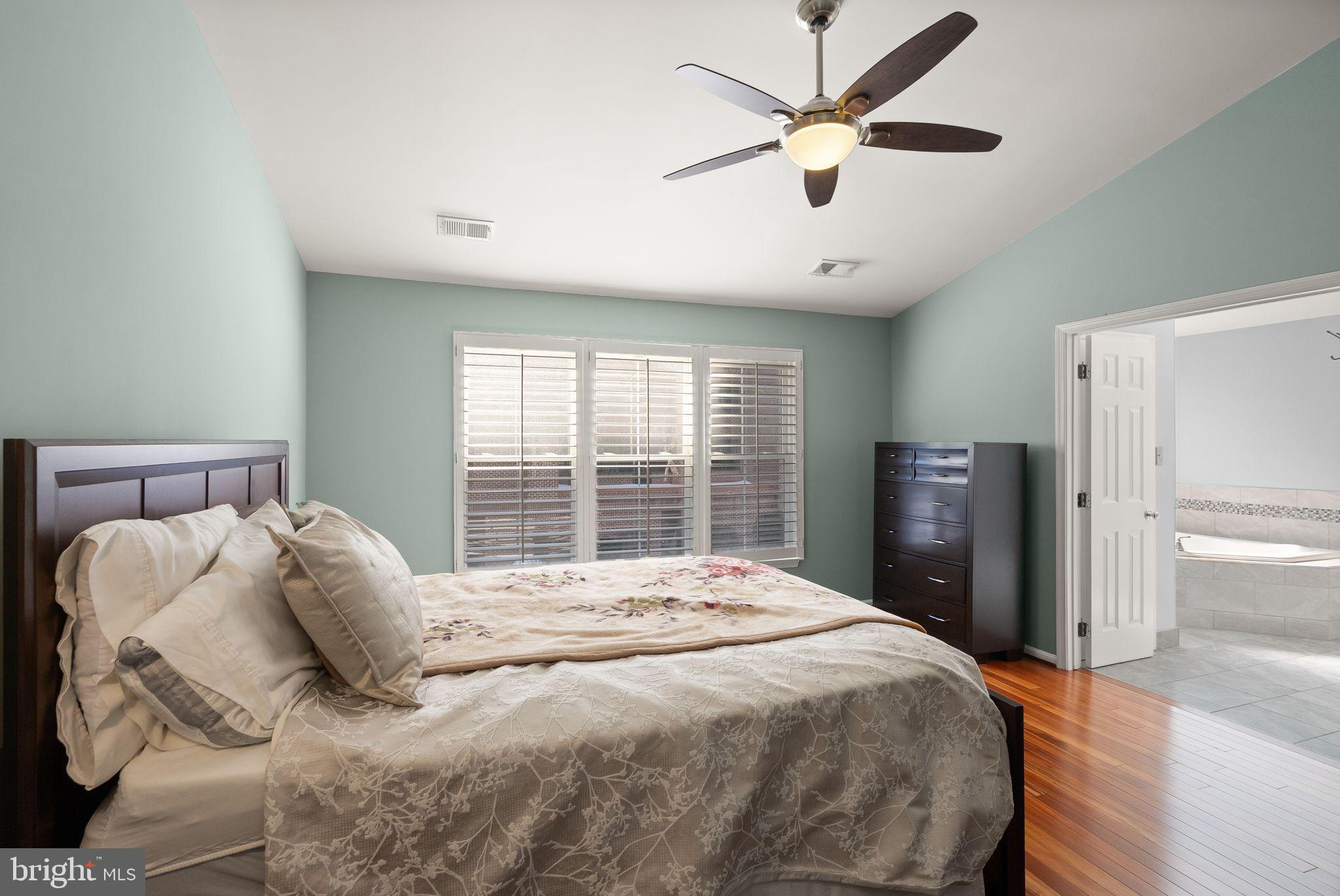 11477 Waterhaven Court Reston, VA 20190 - Photo 32 of 54 a bedroom with a large bed and a window
