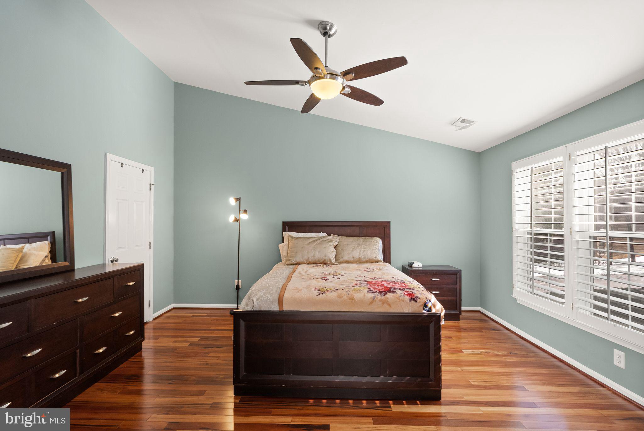 11477 Waterhaven Court Reston, VA 20190 - Photo 33 of 54 a bedroom with a bed and a dresser