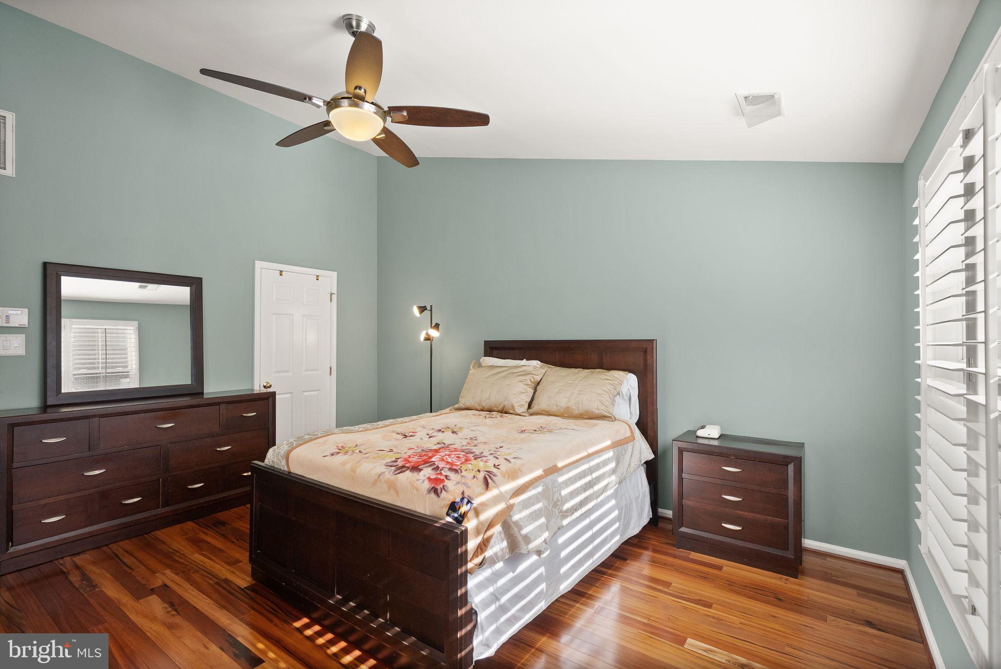 11477 Waterhaven Court Reston, VA 20190 - Photo 34 of 54 a bedroom with a bed and a dresser