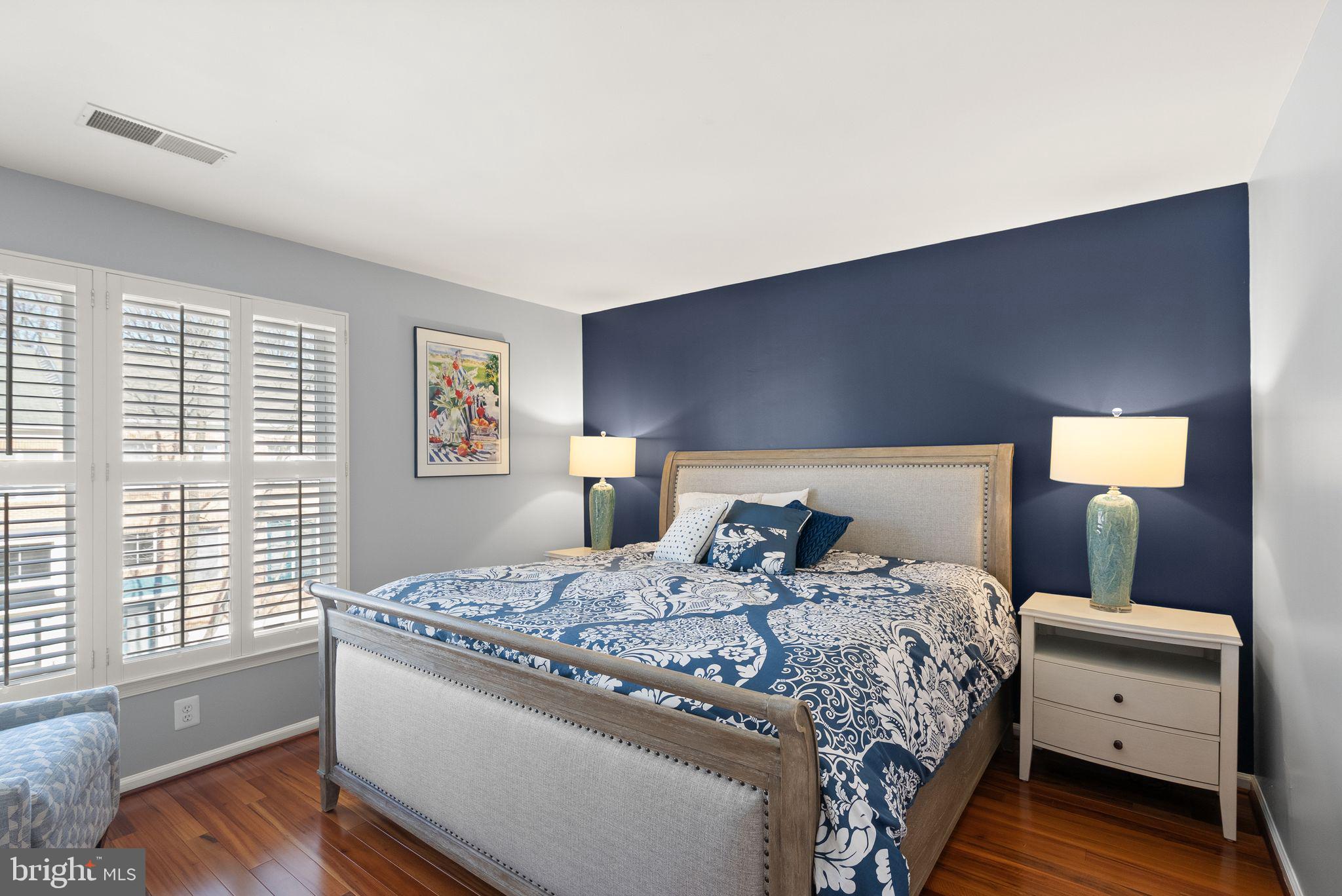 11477 Waterhaven Court Reston, VA 20190 - Photo 40 of 54 a bedroom with a bed and wooden floor