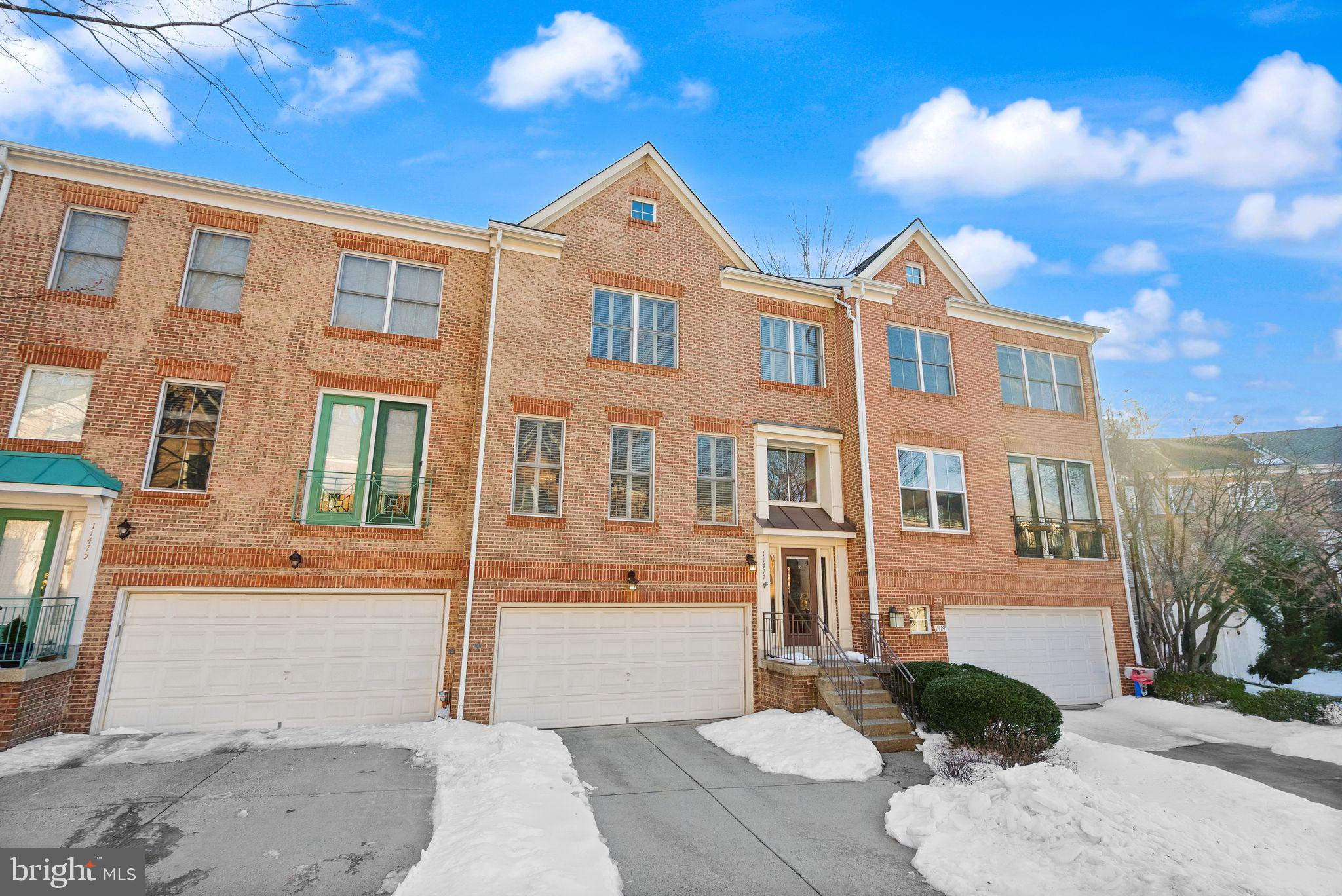 11477 Waterhaven Court Reston, VA 20190 - Photo 4 of 54 a front view of a house with a yard