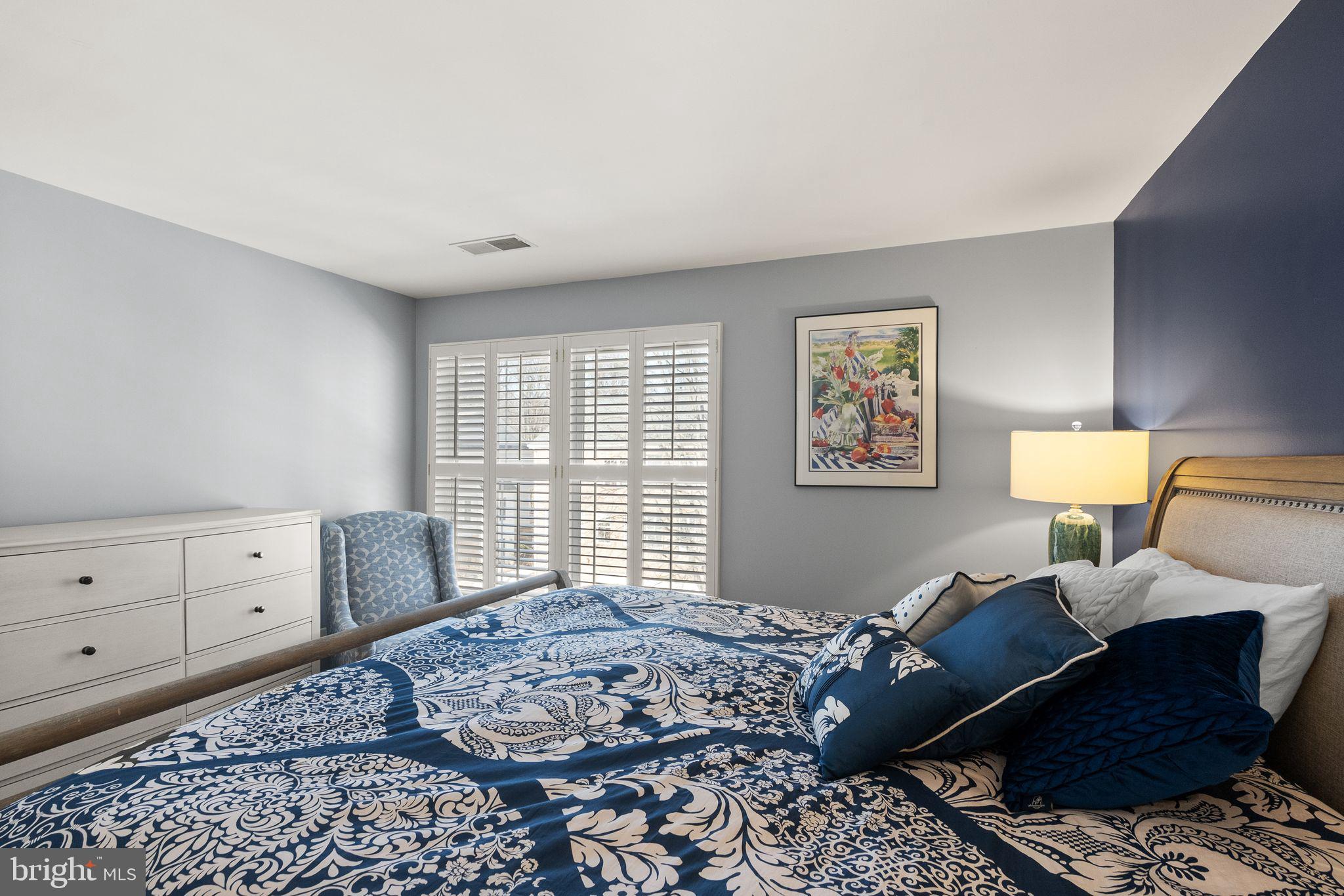 11477 Waterhaven Court Reston, VA 20190 - Photo 41 of 54 a bedroom with a bed and wooden floor