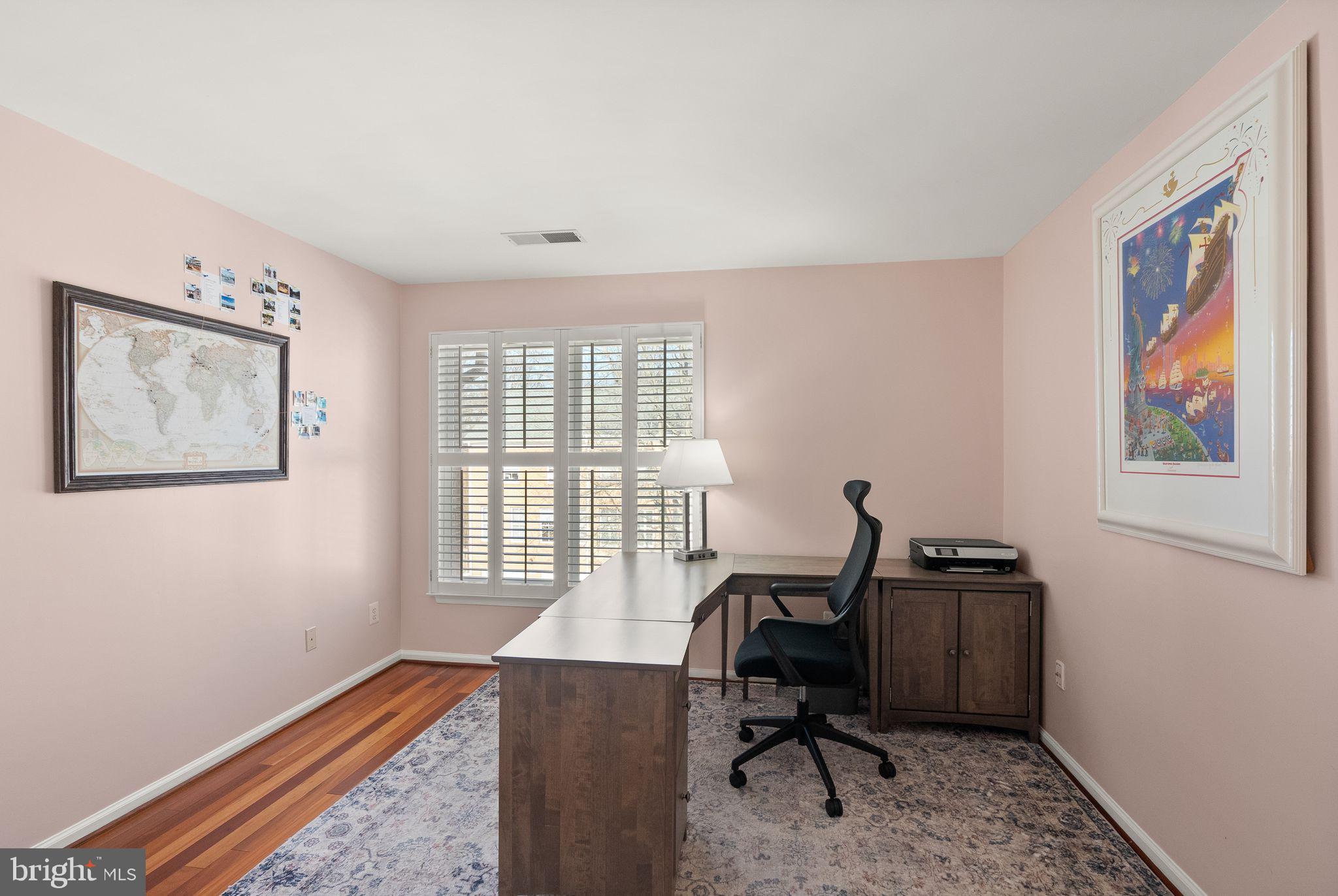 11477 Waterhaven Court Reston, VA 20190 - Photo 43 of 54 a view of a workspace with furniture and a window
