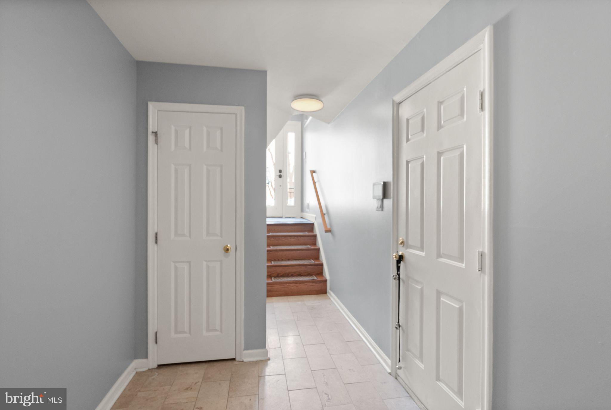 11477 Waterhaven Court Reston, VA 20190 - Photo 47 of 54 a view of a hallway with wooden floor and entryway