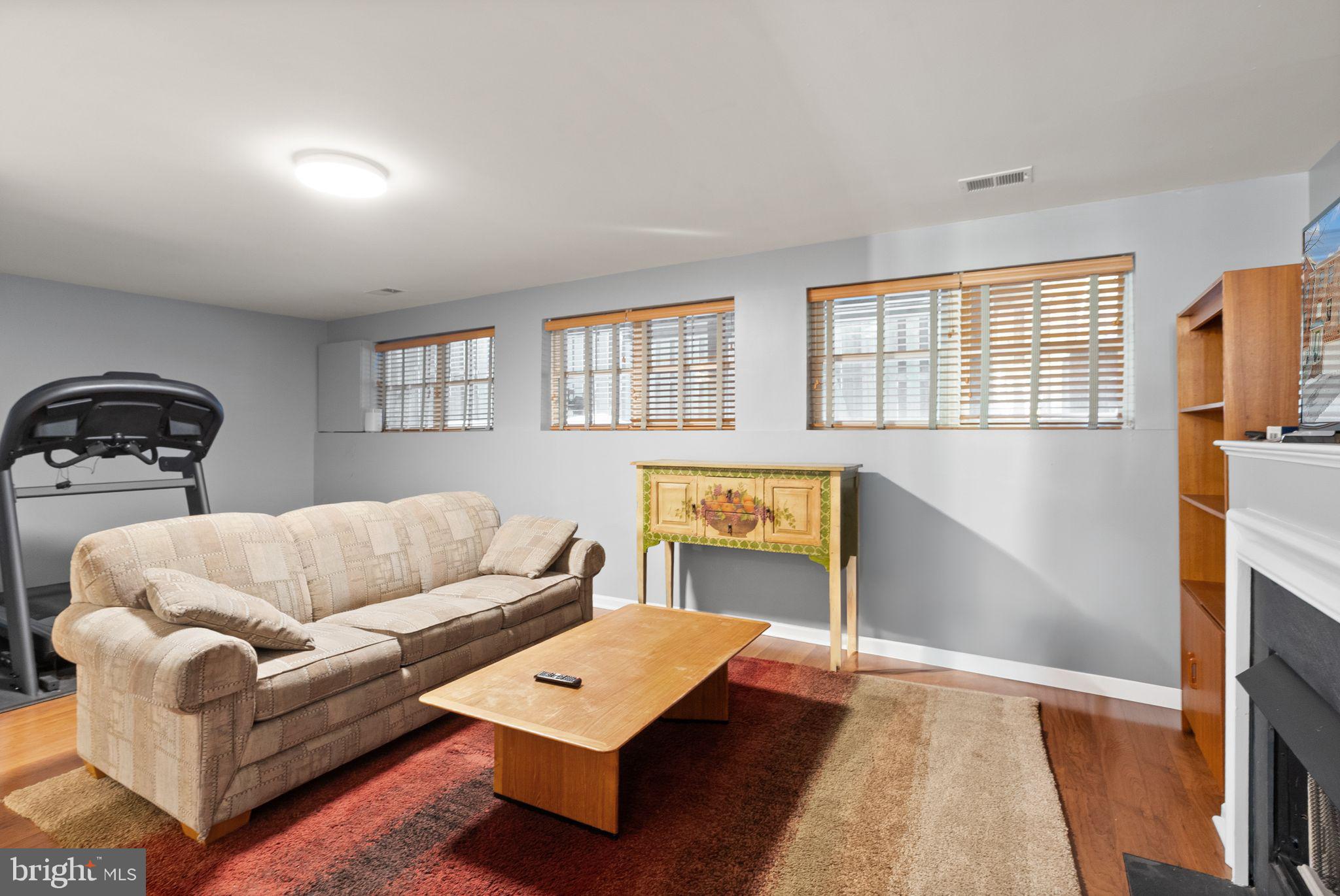 11477 Waterhaven Court Reston, VA 20190 - Photo 48 of 54 a living room with furniture and a window
