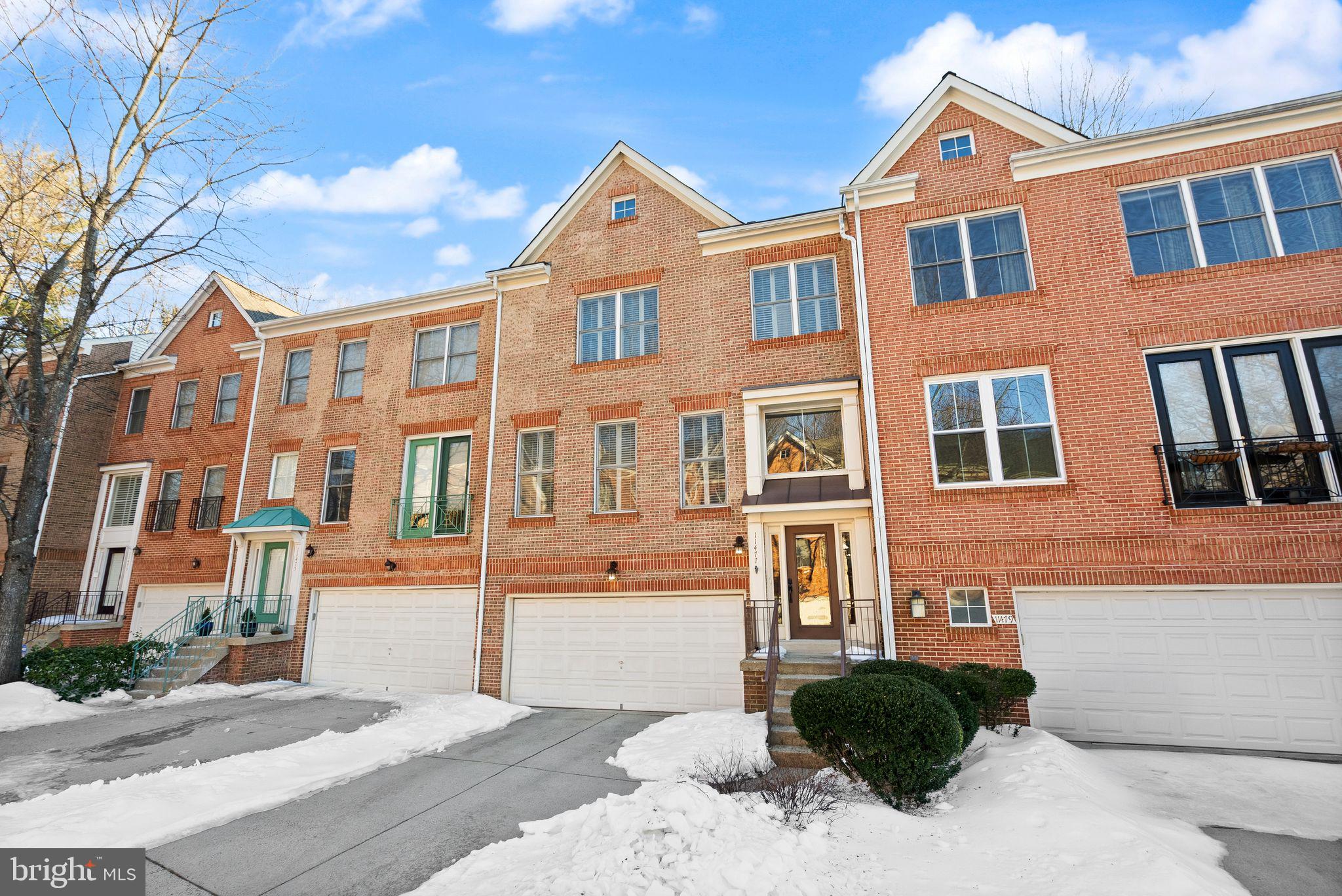 11477 Waterhaven Court Reston, VA 20190 - Photo 5 of 54 a front view of a multi story residential apartment building
