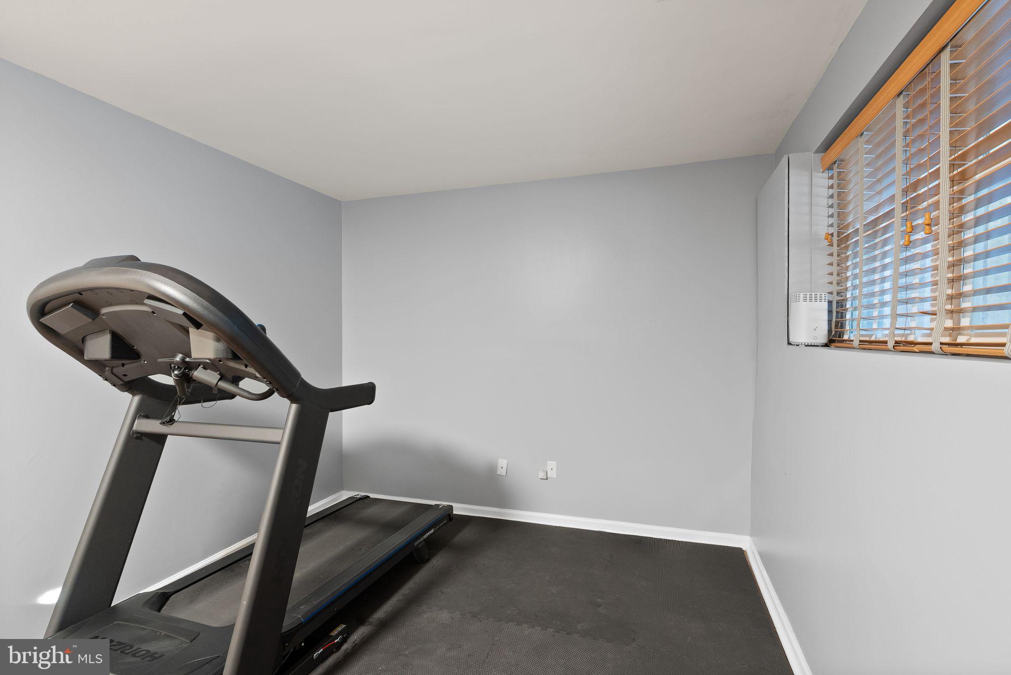 11477 Waterhaven Court Reston, VA 20190 - Photo 52 of 54 a view of a room with gym equipment