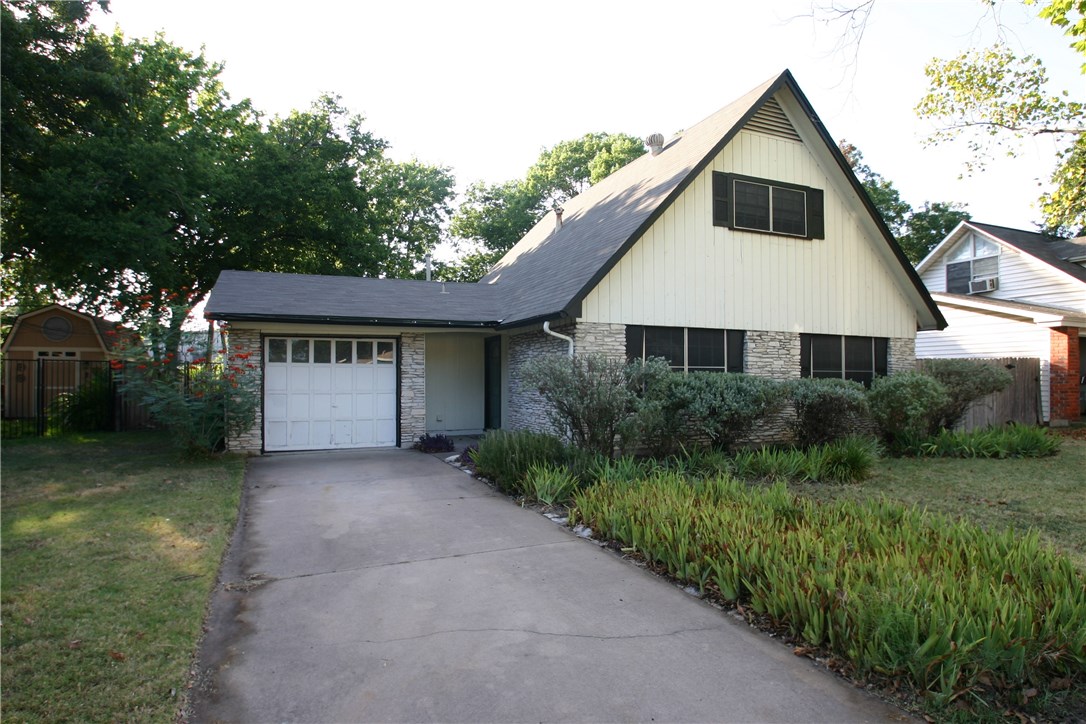 6702 Isabelle Drive Austin, TX 78752 - Photo 1 of 1 a front view of house with yard and green space