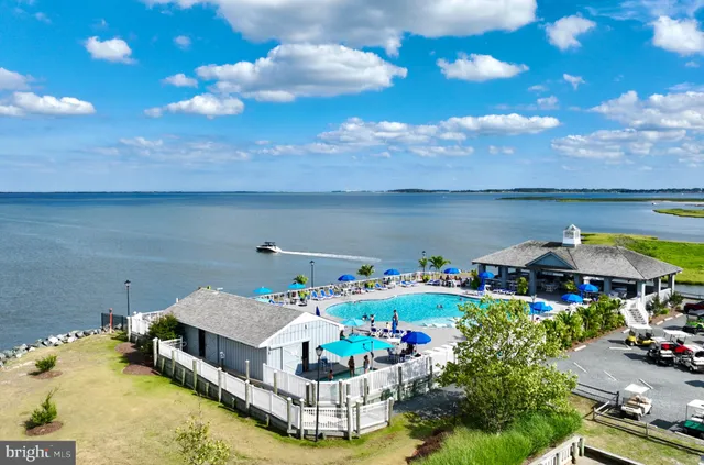 a aerial view of a house with table and chairs