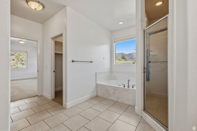 1001 Pine Valley Road Pine Valley, UT 84781 - Photo 40 of 49 Full bath with a marble finish shower, a bath, light tile patterned floors, and a spacious closet
