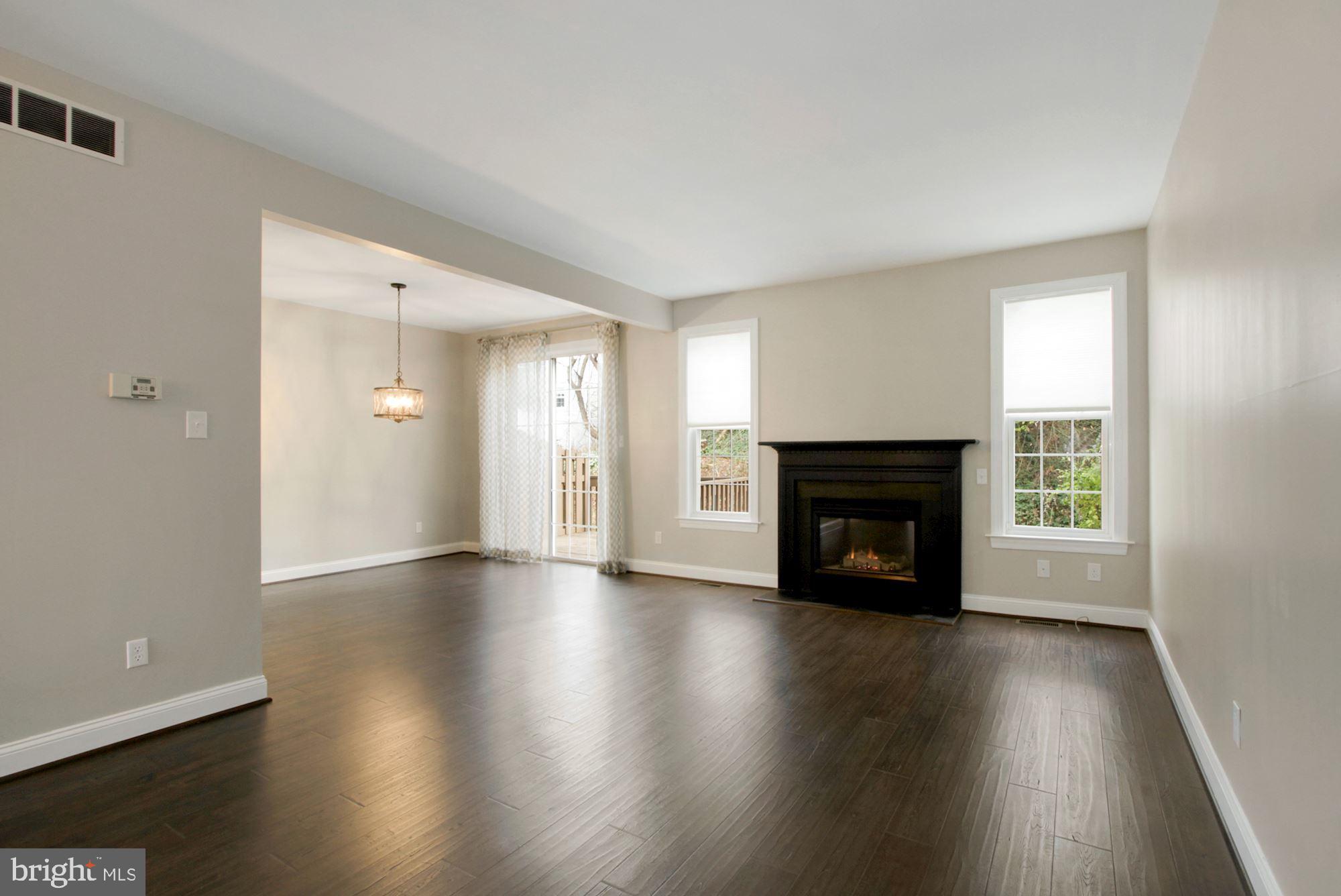 112 Federal Walk Kennett Square, PA 19348 - Photo 11 of 51 an empty room with wooden floor fireplace and windows