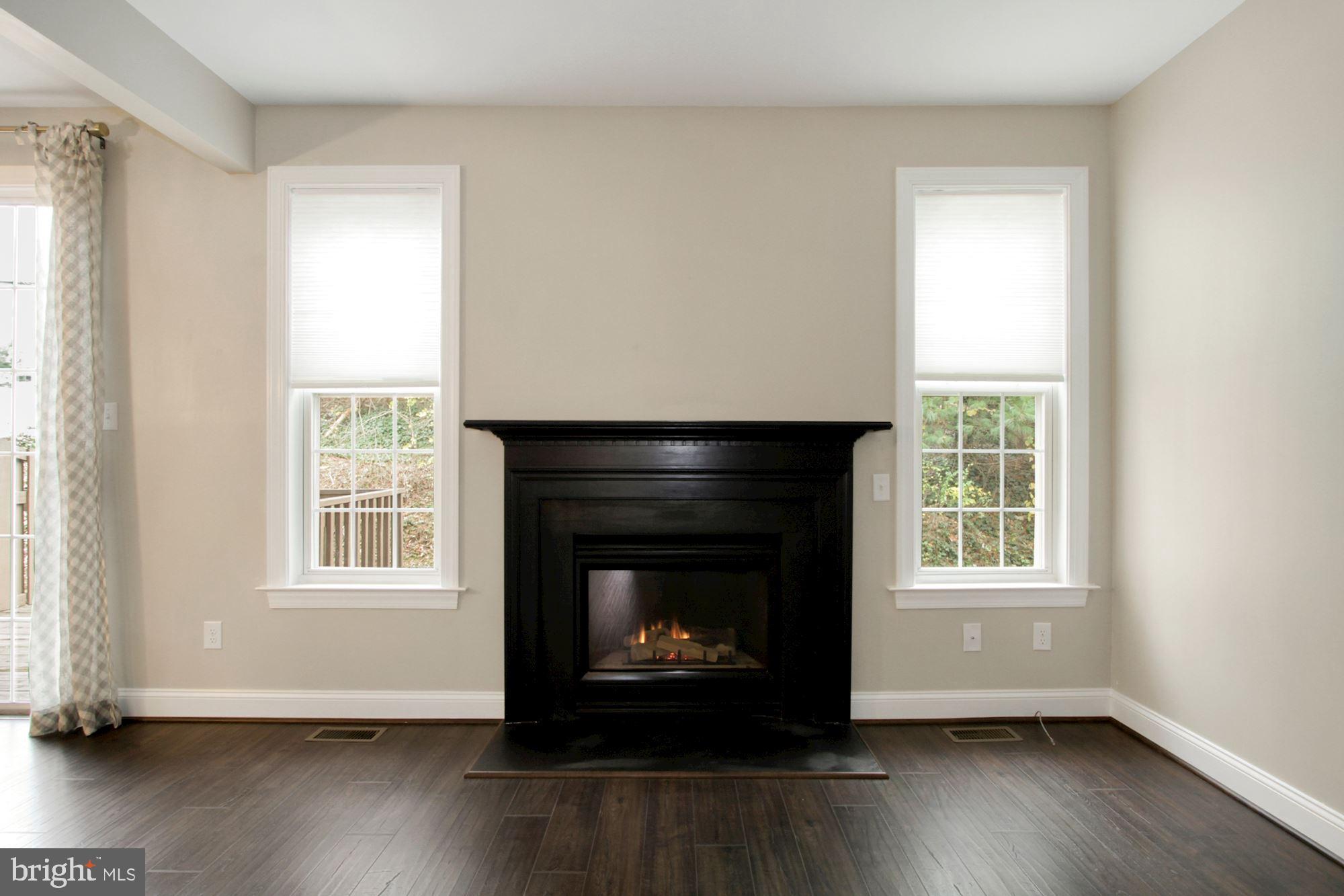 112 Federal Walk Kennett Square, PA 19348 - Photo 14 of 51 a living room with wooden floor and a fireplace