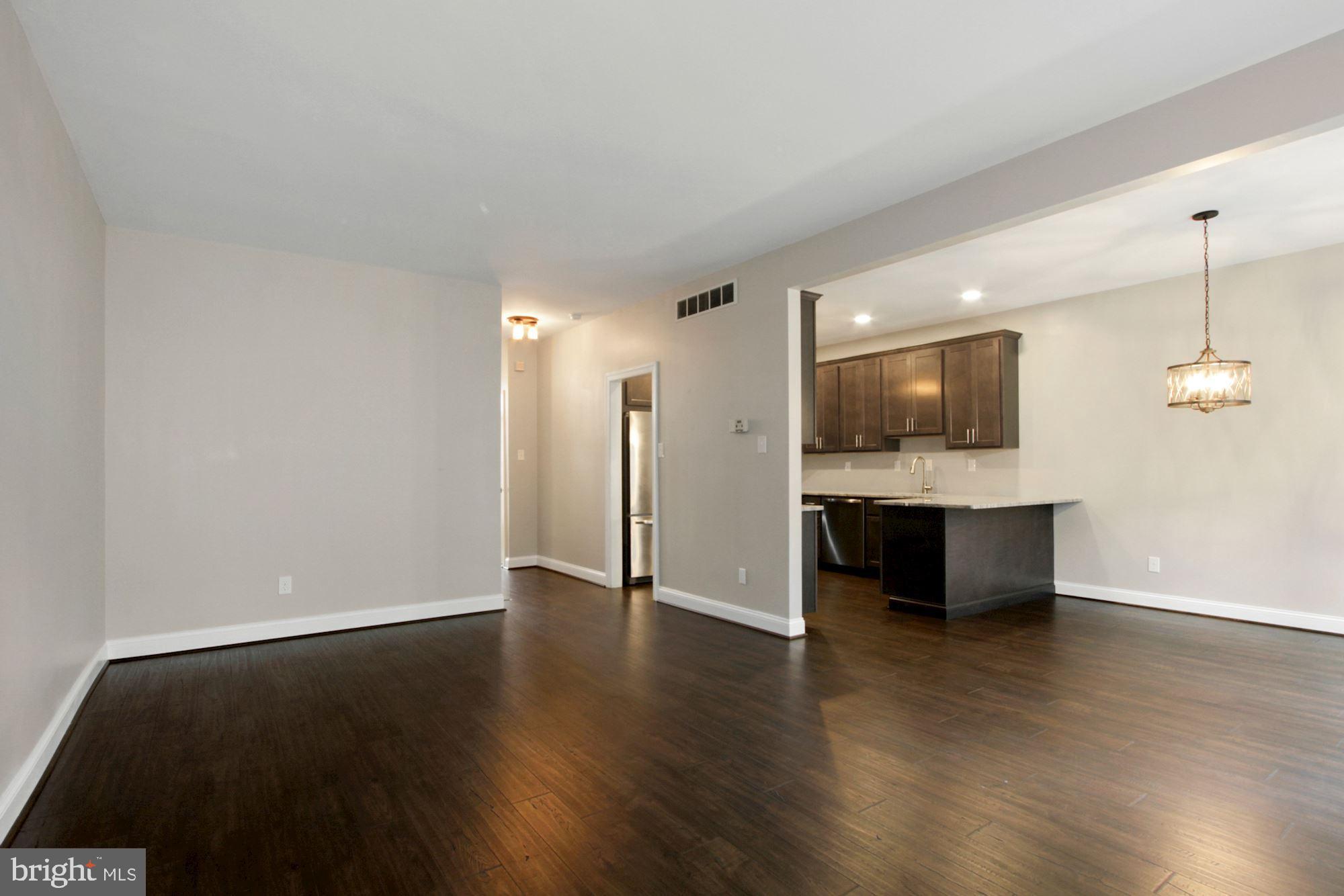 112 Federal Walk Kennett Square, PA 19348 - Photo 15 of 51 a view of an empty room with wooden floor and a cabinet
