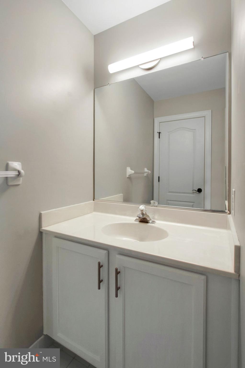 112 Federal Walk Kennett Square, PA 19348 - Photo 41 of 51 a bathroom with a sink and a mirror