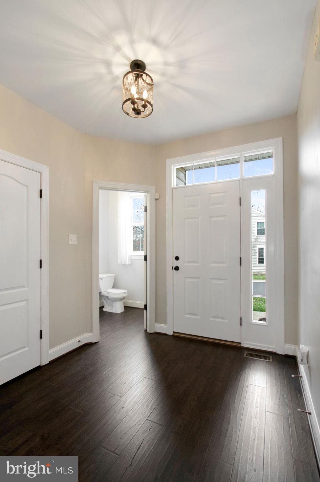 112 Federal Walk Kennett Square, PA 19348 - Photo 7 of 51 an empty room with wooden floor and windows