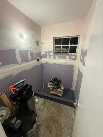 a room with furniture and air hockey table