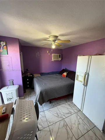 a bedroom with a bed and a mirror