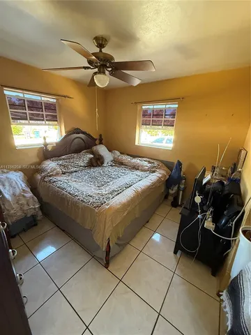 a bed room with a bed and a dresser