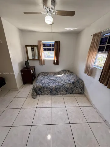 a bedroom with a bed and a walk in closet