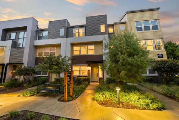 a swimming pool view with a outdoor seating