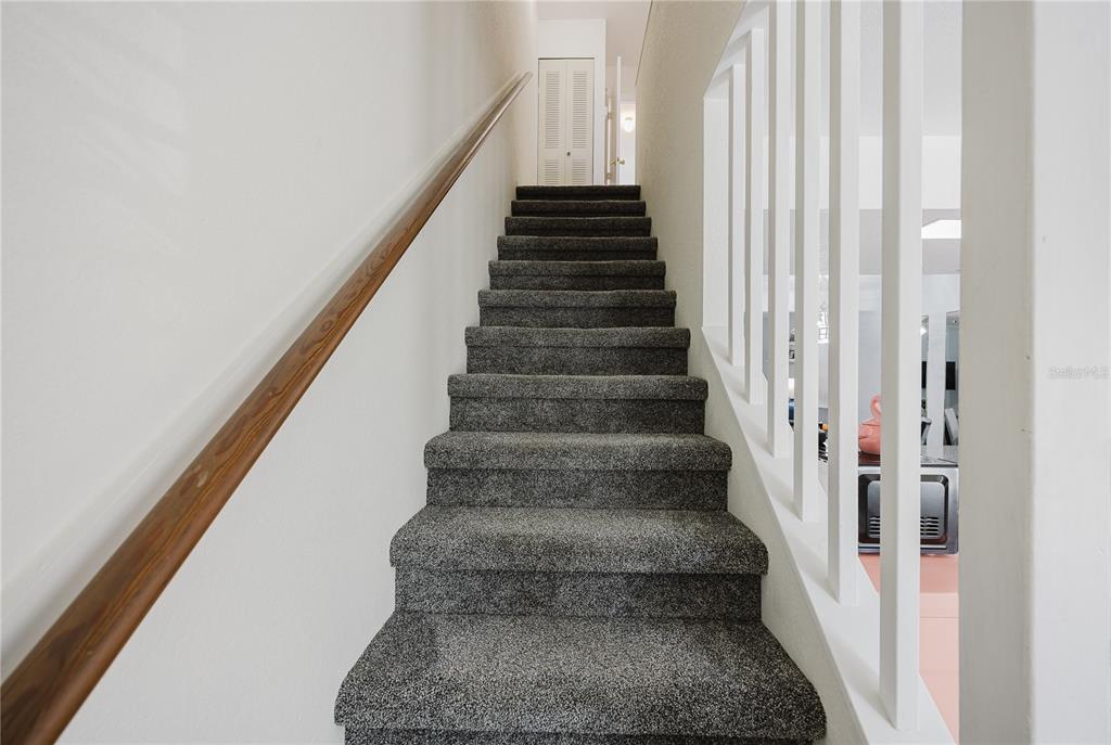 26282 Rampart Boulevard, Unit 204 Punta Gorda, FL 33983 - Photo 19 of 34 a view of staircase with white walls