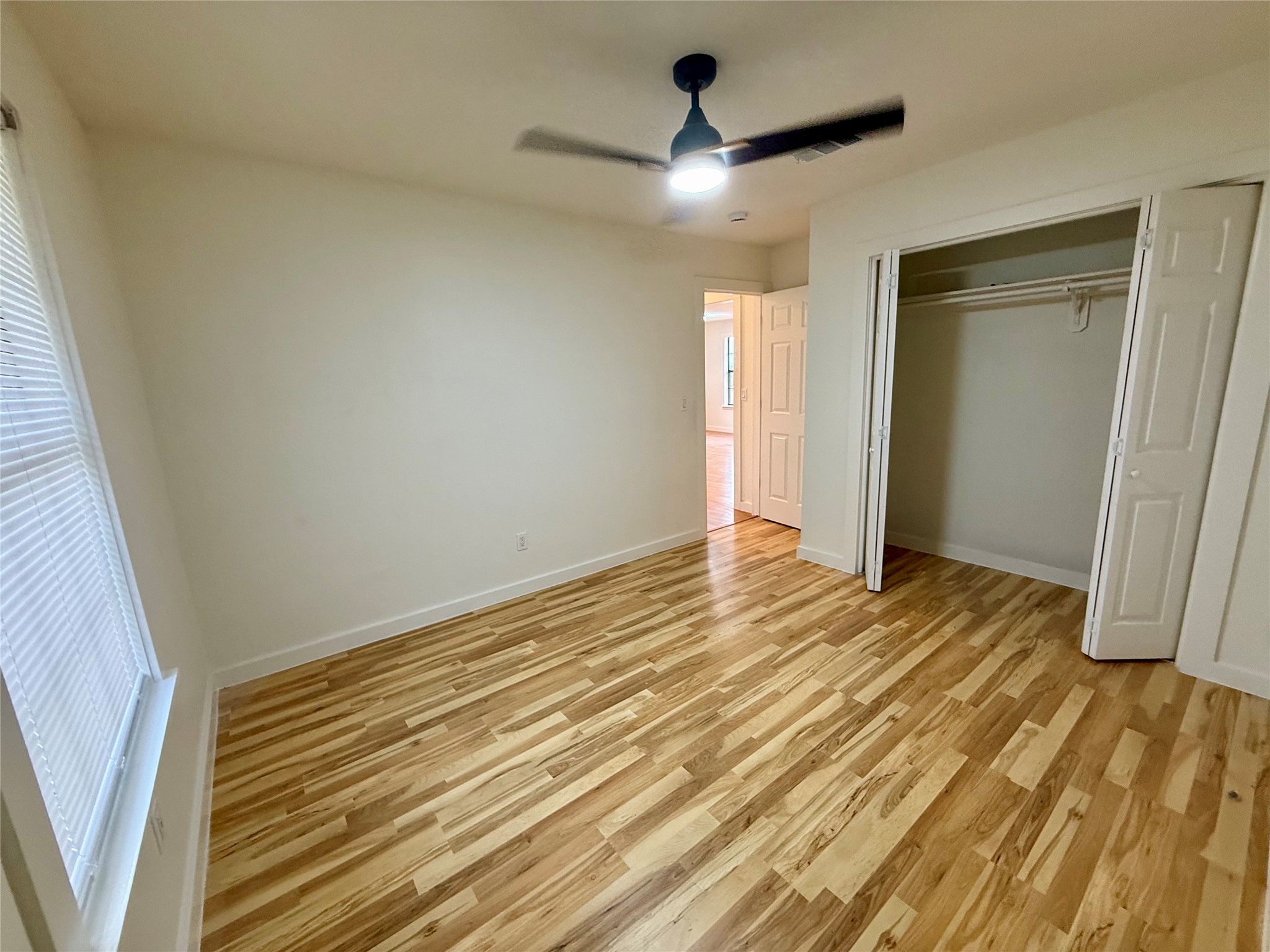 21003 Boggy Ford Road, Unit A Lago Vista, TX 78645 - Photo 6 of 19 a view of an empty room and wooden floor