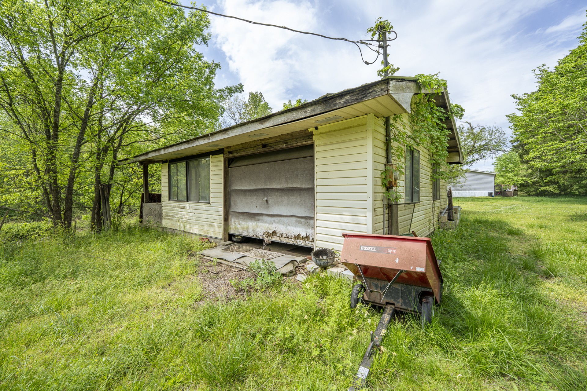 4242 Upper Factory Creek Road Waynesboro, TN 38485 - Photo 22 of 30 a backyard of a house with seating space