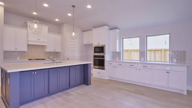a bathroom with a sink a toilet a mirror and shower