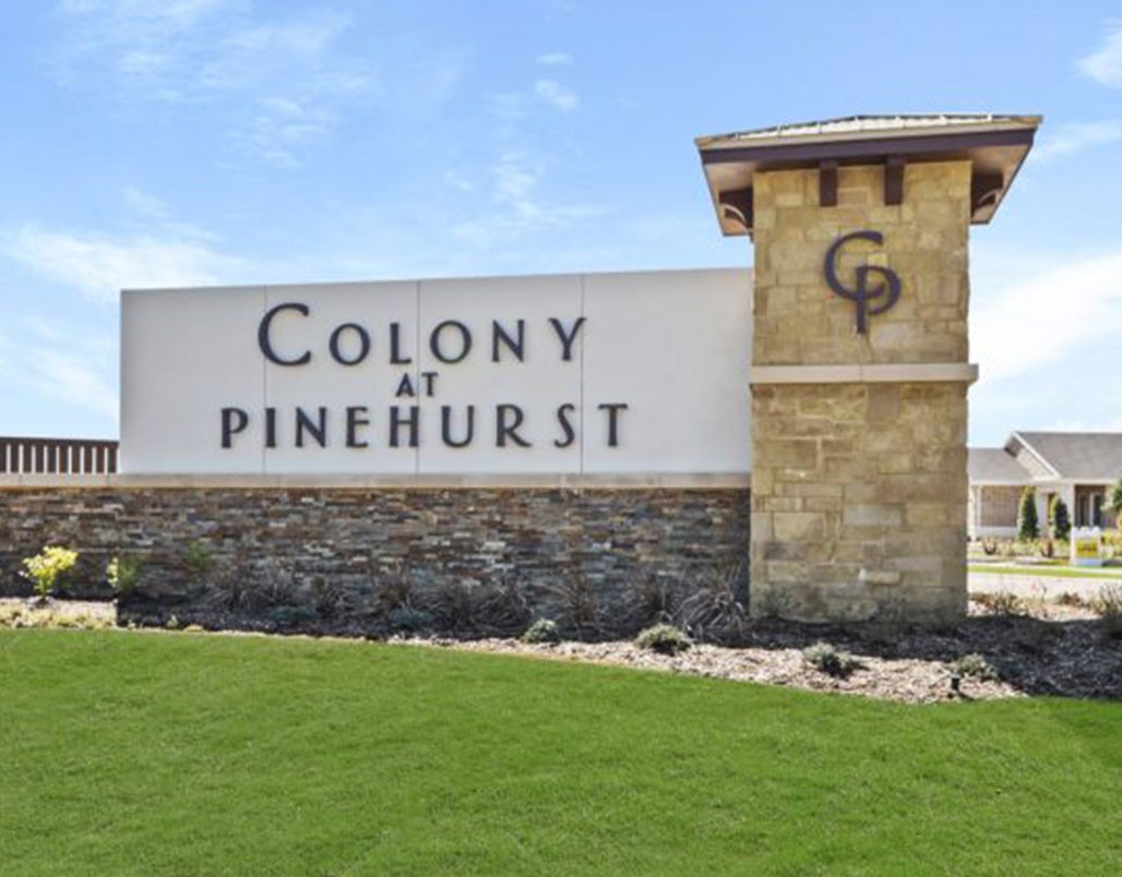4814 Petunia Bloom Road Pinehurst, TX 77362 - Photo 5 of 5 a sign board with a house in the background