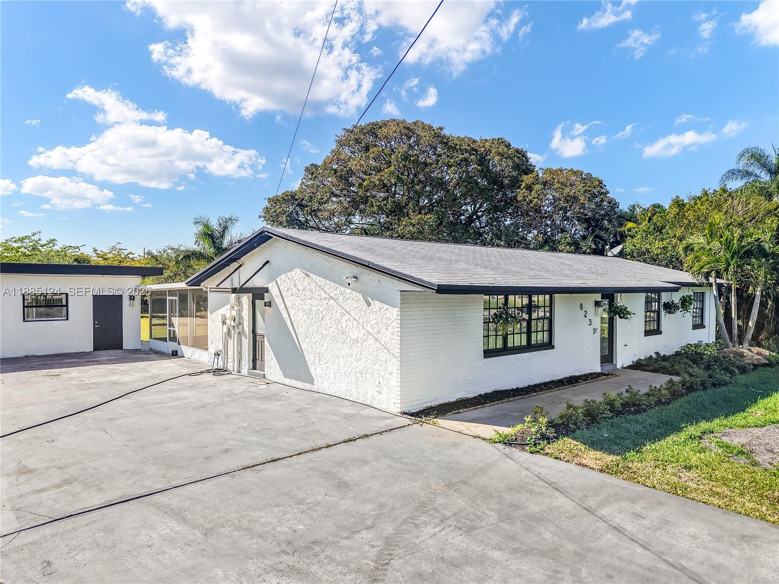 6231 Southwest 188th Avenue Southwest Ranches, FL 33332 - Photo 12 of 40 front view of a house with a street