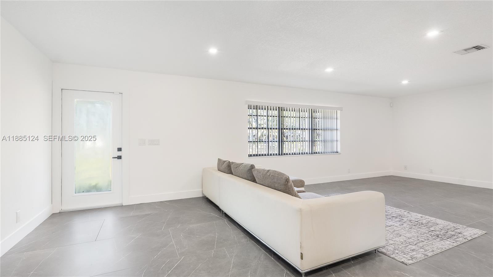 6231 Southwest 188th Avenue Southwest Ranches, FL 33332 - Photo 15 of 40 a living room with furniture and a window