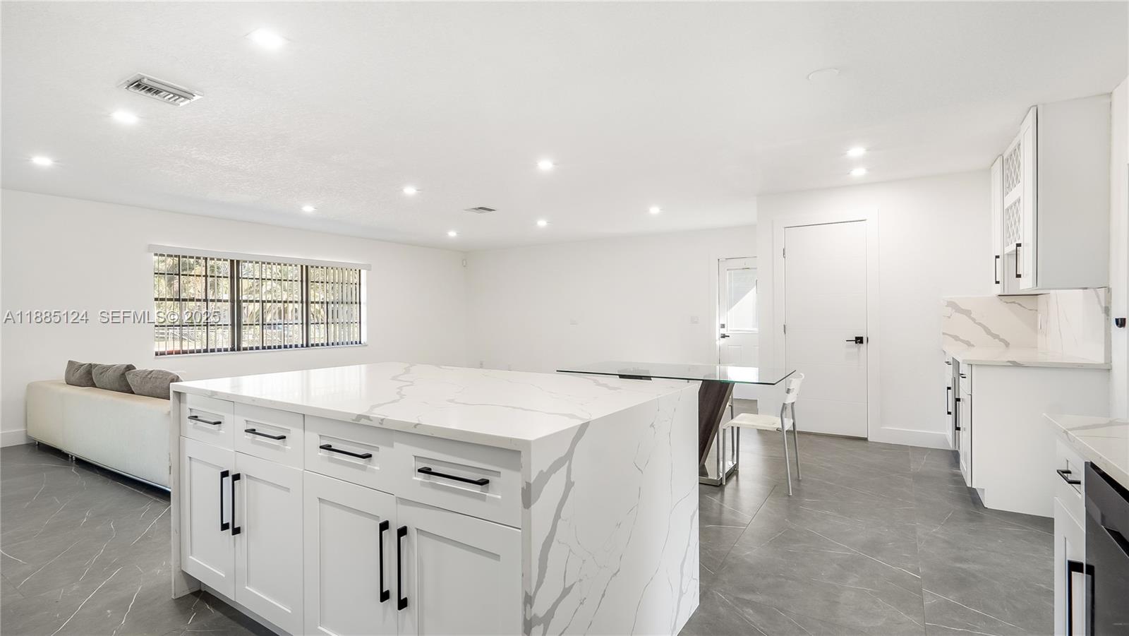 6231 Southwest 188th Avenue Southwest Ranches, FL 33332 - Photo 18 of 40 a kitchen that has a lot of cabinets in it and wooden floors