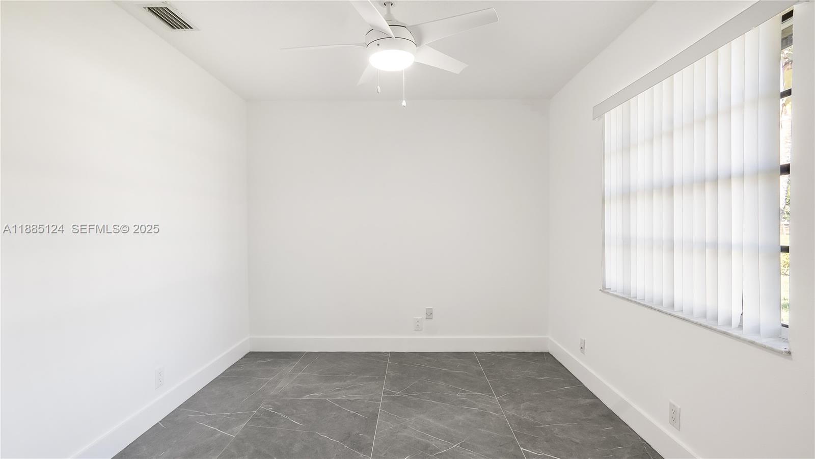 6231 Southwest 188th Avenue Southwest Ranches, FL 33332 - Photo 22 of 40 an empty room with a window and a fan