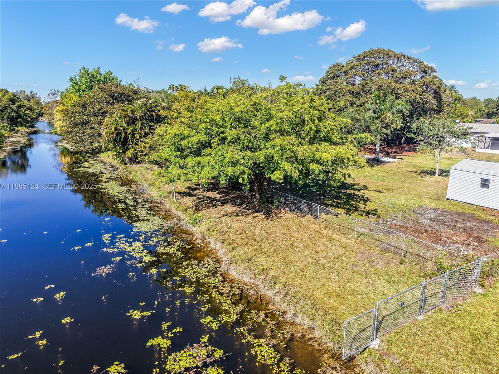 6231 Southwest 188th Avenue Southwest Ranches, FL 33332 - Photo 23 of 40 a view of a lake with a yard