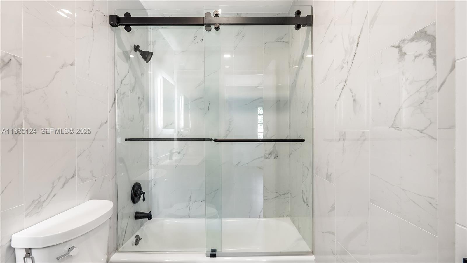 6231 Southwest 188th Avenue Southwest Ranches, FL 33332 - Photo 25 of 40 a bathroom with a shower and a toilet