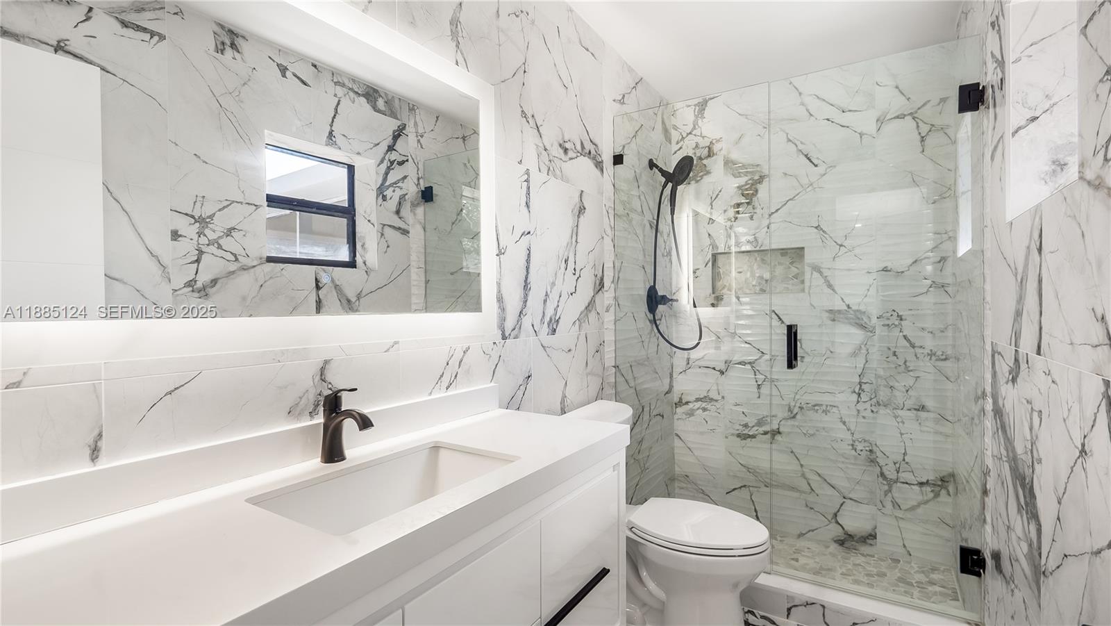 6231 Southwest 188th Avenue Southwest Ranches, FL 33332 - Photo 28 of 40 a bathroom with a sink toilet and shower