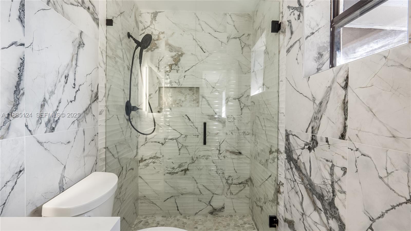 6231 Southwest 188th Avenue Southwest Ranches, FL 33332 - Photo 29 of 40 a bathroom with a toilet sink and shower