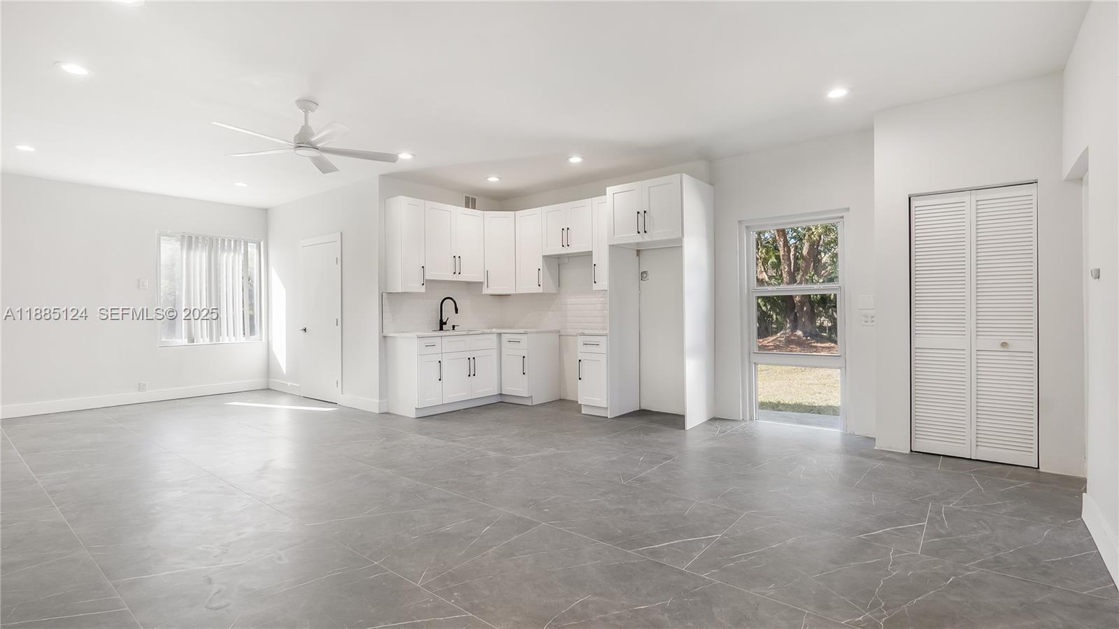 6231 Southwest 188th Avenue Southwest Ranches, FL 33332 - Photo 35 of 40 a view of a kitchen with refrigerator and a sink