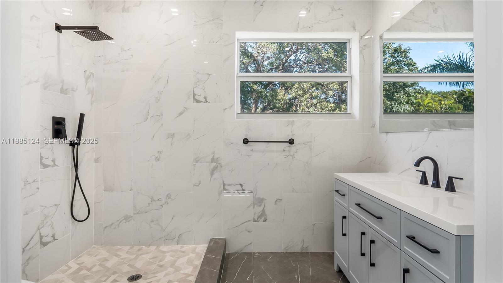 6231 Southwest 188th Avenue Southwest Ranches, FL 33332 - Photo 37 of 40 a bathroom with a sink a vanity and window