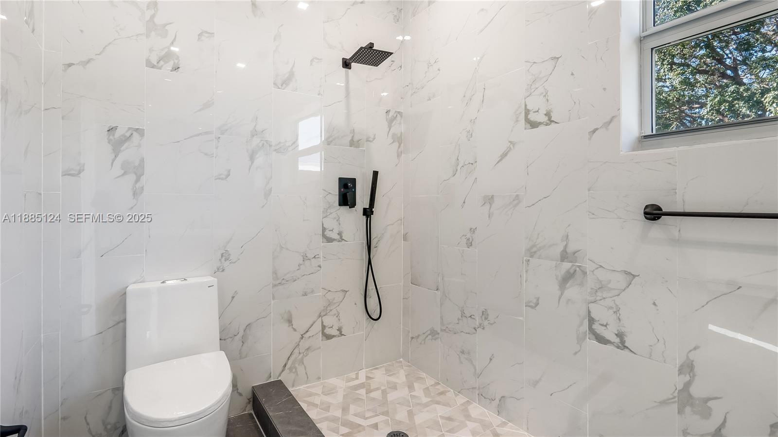 6231 Southwest 188th Avenue Southwest Ranches, FL 33332 - Photo 38 of 40 a white toilet sitting next to a bath tub sitting next to a shower