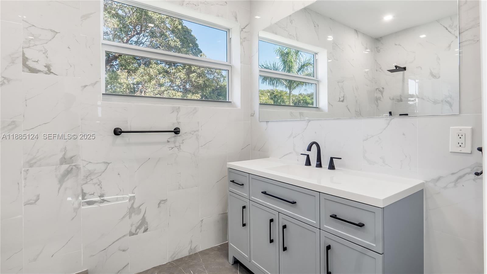 6231 Southwest 188th Avenue Southwest Ranches, FL 33332 - Photo 39 of 40 a bathroom with a sink vanity and a mirror